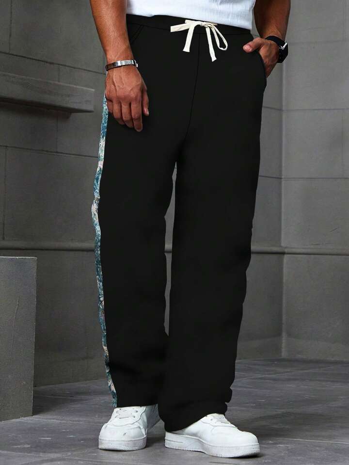 Black floral ocean trackpants